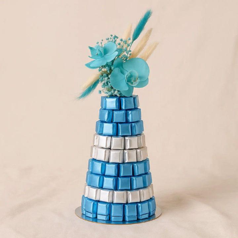 The Azure Sky Tower: Chocolate Pyramid with Blue Floral Topper